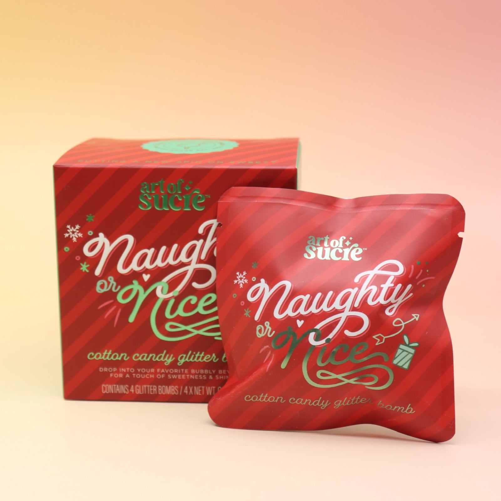 The Naughty or Nice Cotton Candy Drink Glitter Bombs on a pink and yellow background.