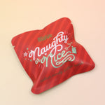 The Naughty or Nice Cotton Candy Drink Glitter Bombs on a pink and yellow background.