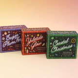 All of the Old Whaling Company Holiday Bar Soaps on a pink and yellow background.