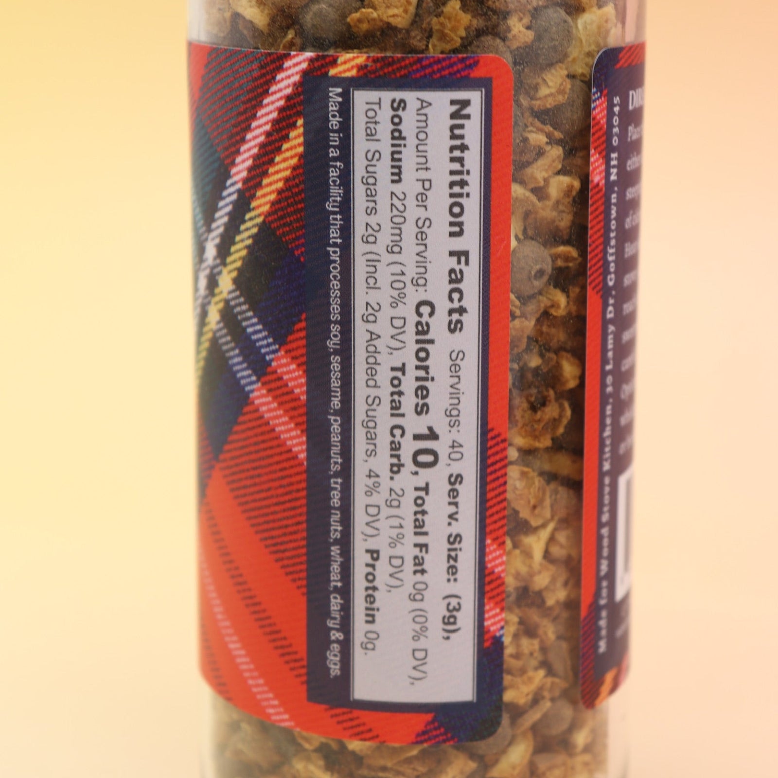 The Mulling Spices bottle on a pink and yellow background.