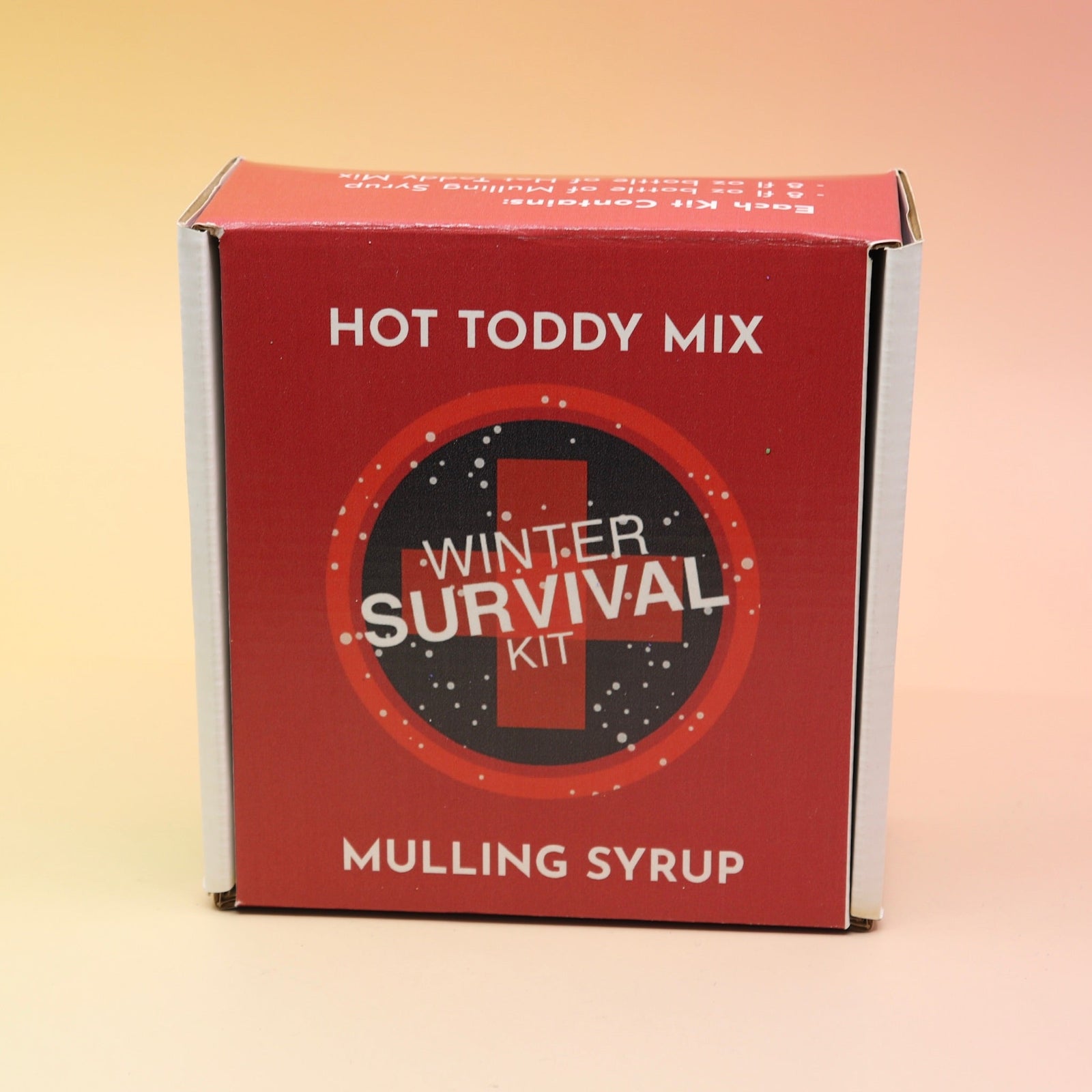 The Winter Survival Gift Set box on a pink and yellow background.