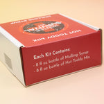 The Winter Survival Gift Set box on a pink and yellow background, showing off the side.