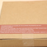 The Cleanse & Manifest Smudge Bundle Kit on a pink and yellow background, showing off the back.