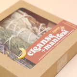 The Cleanse & Manifest Smudge Bundle Kit on a pink and yellow background.