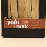 An up-close image of the 6 Pack Palo Santo Cleansing Bundle on a pink and yellow background.