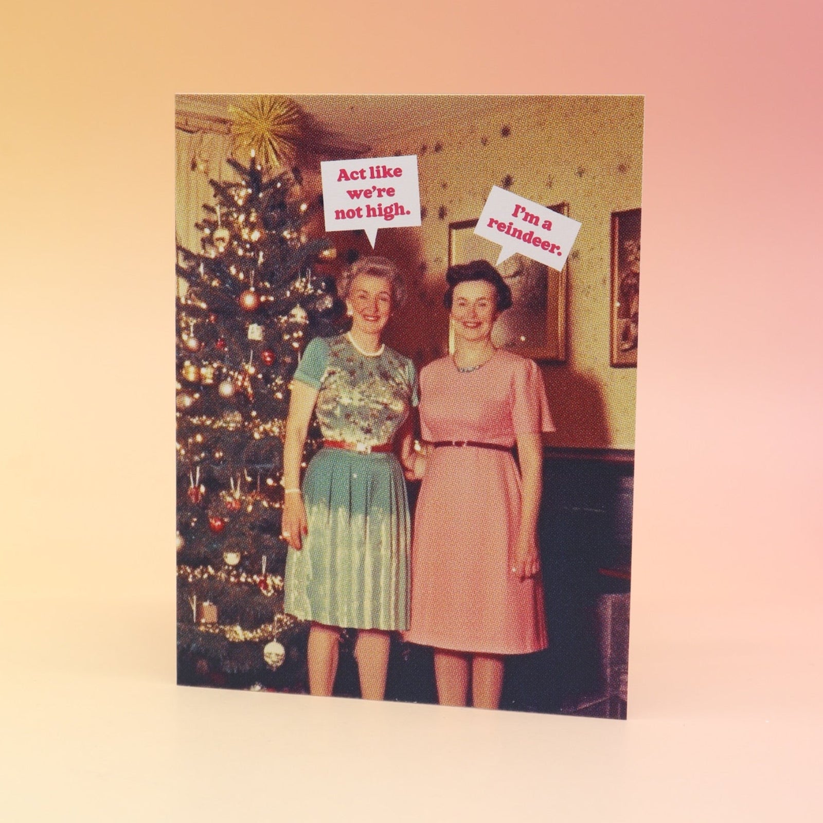 The Act Like We're Not High Christmas Card on a pink and yellow background.