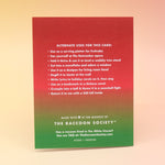 The back of the Death Metal Christmas Card on a pink and yellow background.