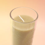 The Rapture Beeswax Aromatherapy Sanctuary Glasses on an agate slice all on a pink and yellow background.