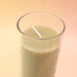 The Rapture Beeswax Aromatherapy Sanctuary Glasses on an agate slice all on a pink and yellow background.