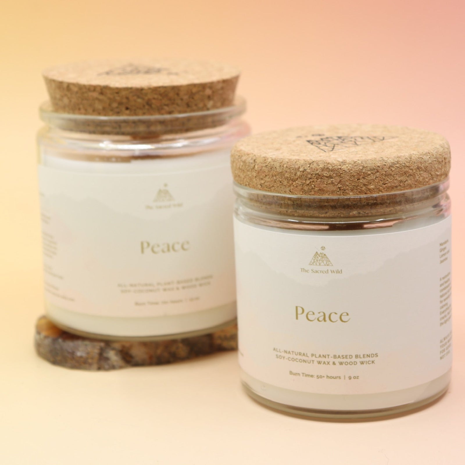 Both of the Peace Intention Candles on an agate slice all on a pink and yellow background.