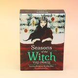 The Seasons of the Witch Yule Oracle Card Deck on a pink and yellow background.