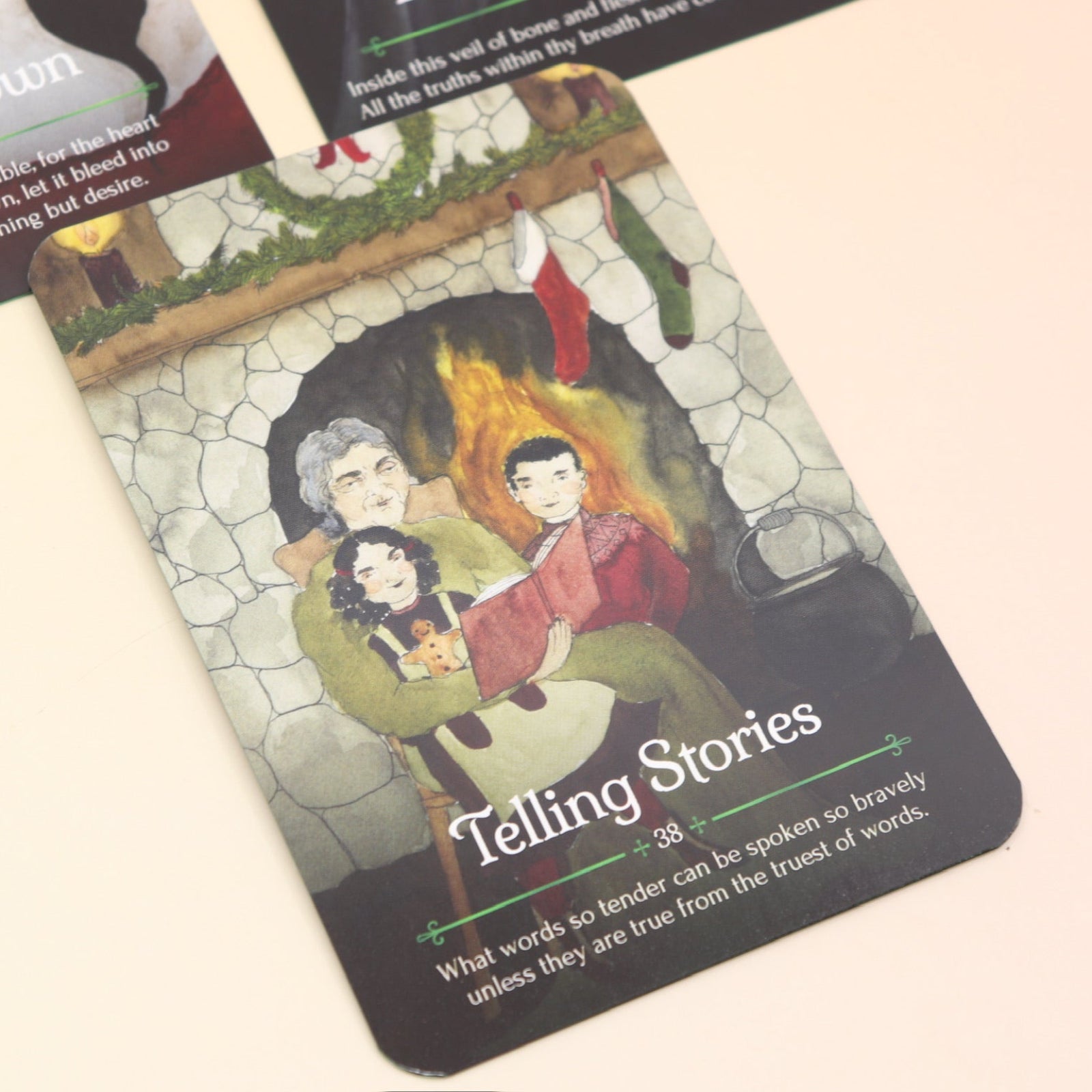 The contents of the Seasons of the Witch Yule Oracle Card Deck on a pink and yellow background.