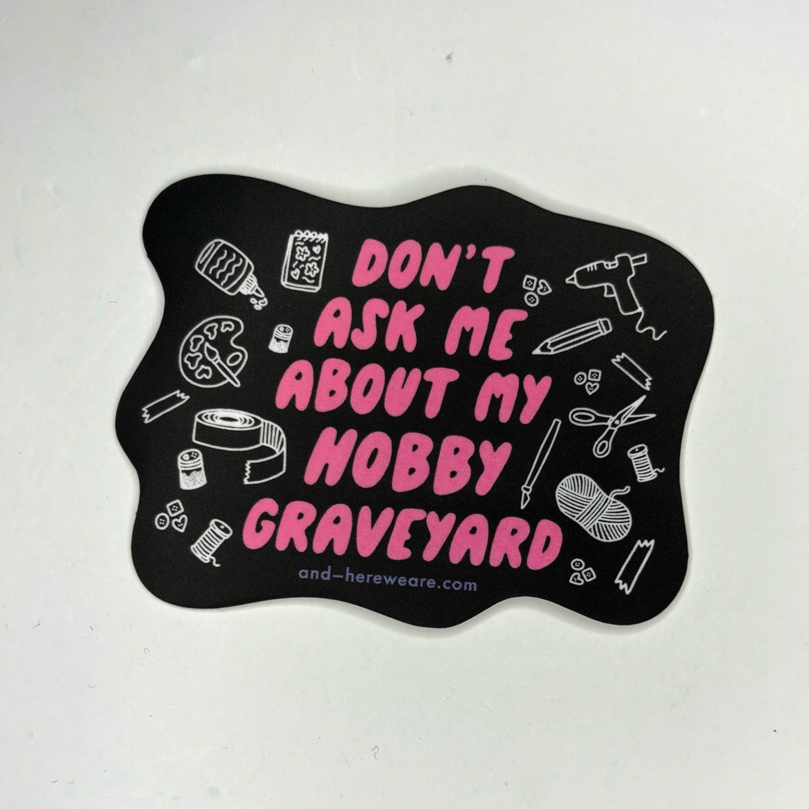 The Don't Ask Me About My Hobby Graveyard - Vinyl Sticker on a gray background.