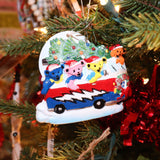 The Grateful Dead Dancing Bear in Van Bus Christmas Ornament hanging on a Christmas tree.