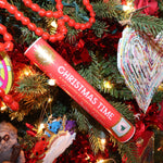 The Christmas Time Pick-up Sticks Conversation Game on a Christmas tree.