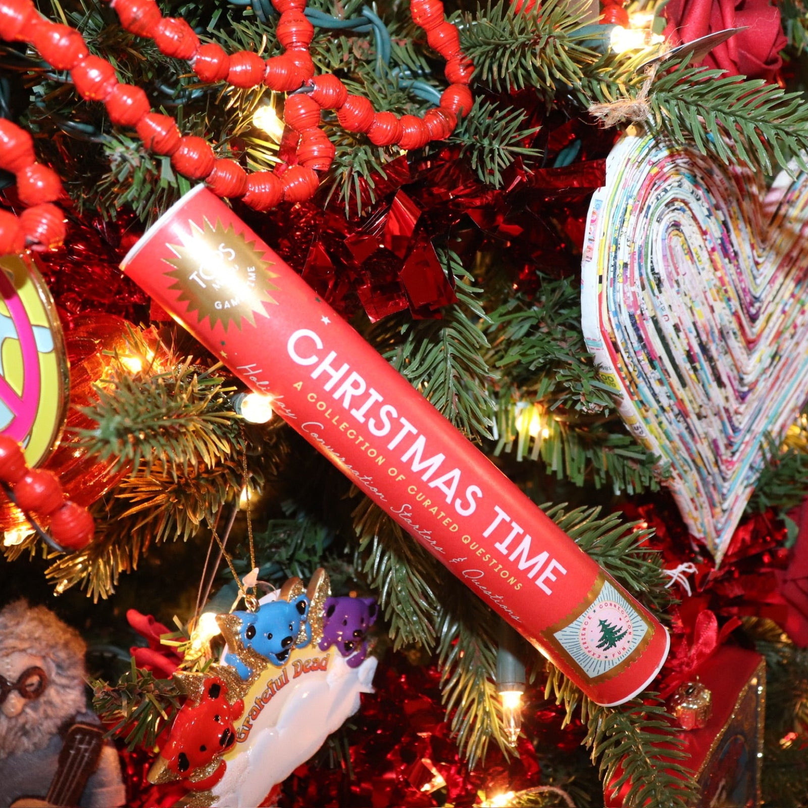 The Christmas Time Pick-up Sticks Conversation Game on a Christmas tree.