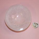 selenite crystal bowl on pink backdrop
