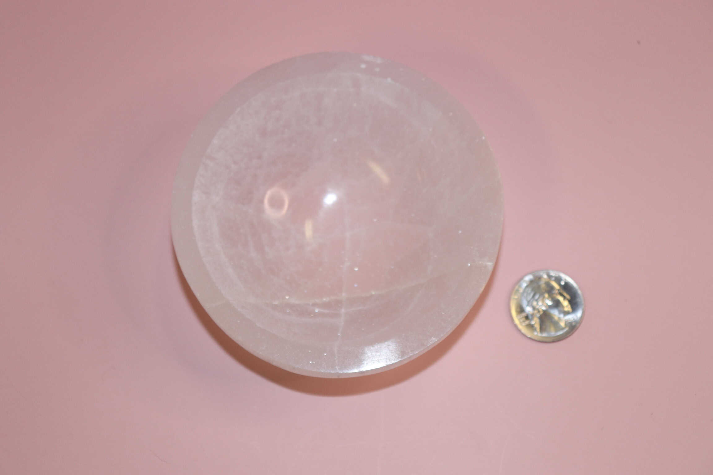 selenite crystal bowl on pink backdrop