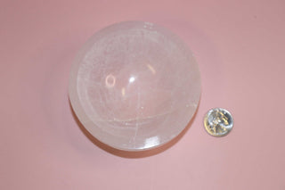 selenite crystal bowl on pink backdrop