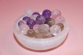 selenite crystal bowl on pink backdrop