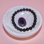 selenite crystal bowl on pink backdrop