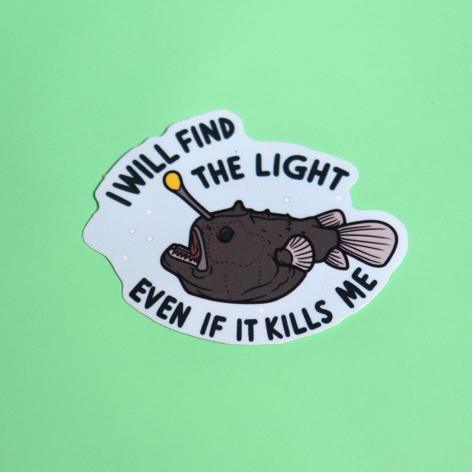 The Anglerfish Vinyl Sticker on a green background.