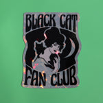 The Black Cat Fan Club 3 Inch Holographic Sticker on a green background.