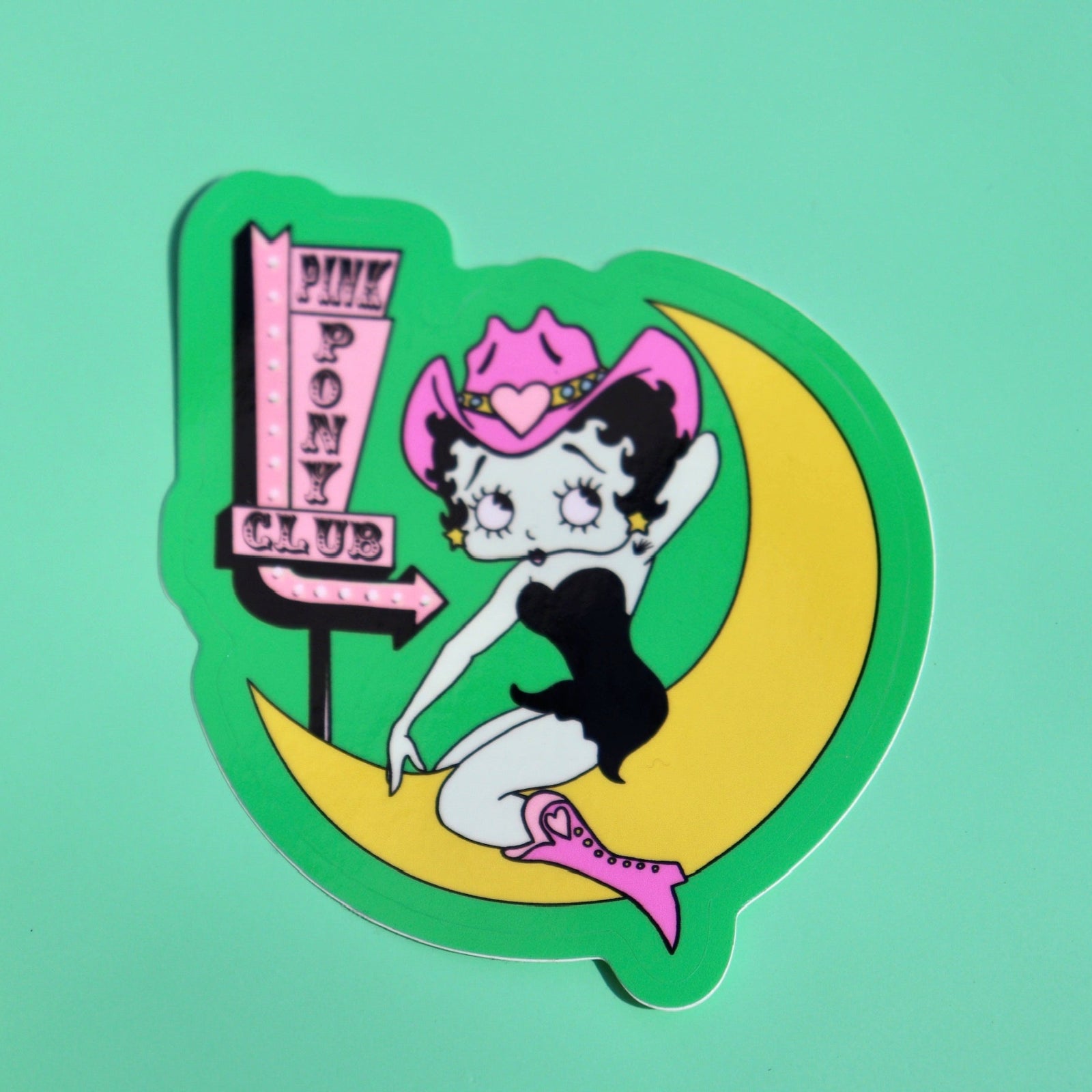 The Pink Pony Club Chappell Roan Sticker on a green background.