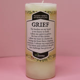 The Affirmation Grief Candle - Pillar Candle with Cypress Blend on a pink background.