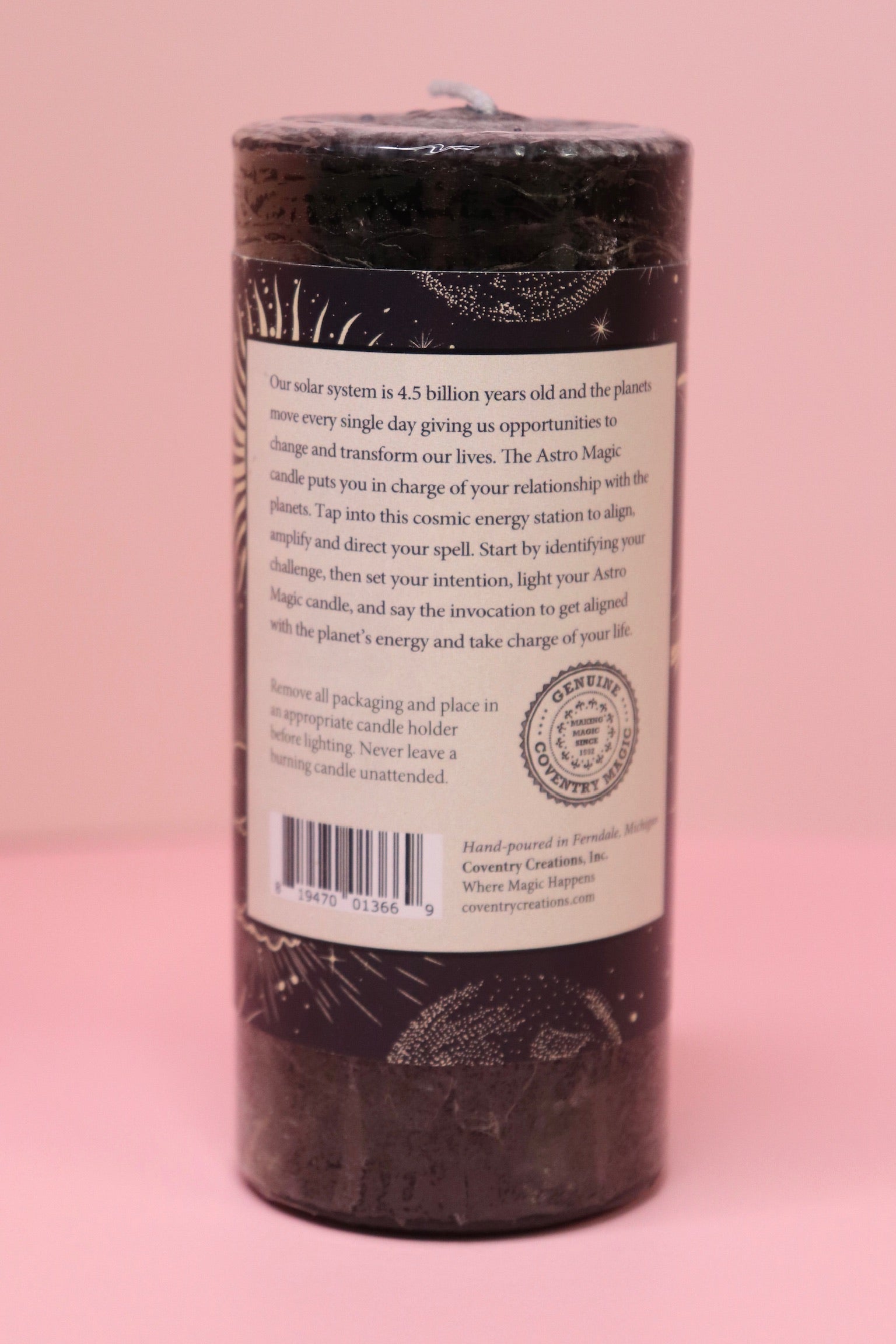 The back of the Astro Magic New Moon - Let it Grow Pillar Candle on a pink background.