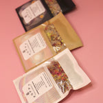 All three of the Poppy California Bath Salt Packets on a pink background.
