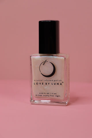 The Full Moon Nail Polish on a pink background.