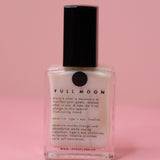 The Full Moon Nail Polish on a pink background.