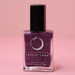 The Luminous Dreams Nail Polish with Micronized Amethyst on a pink background.