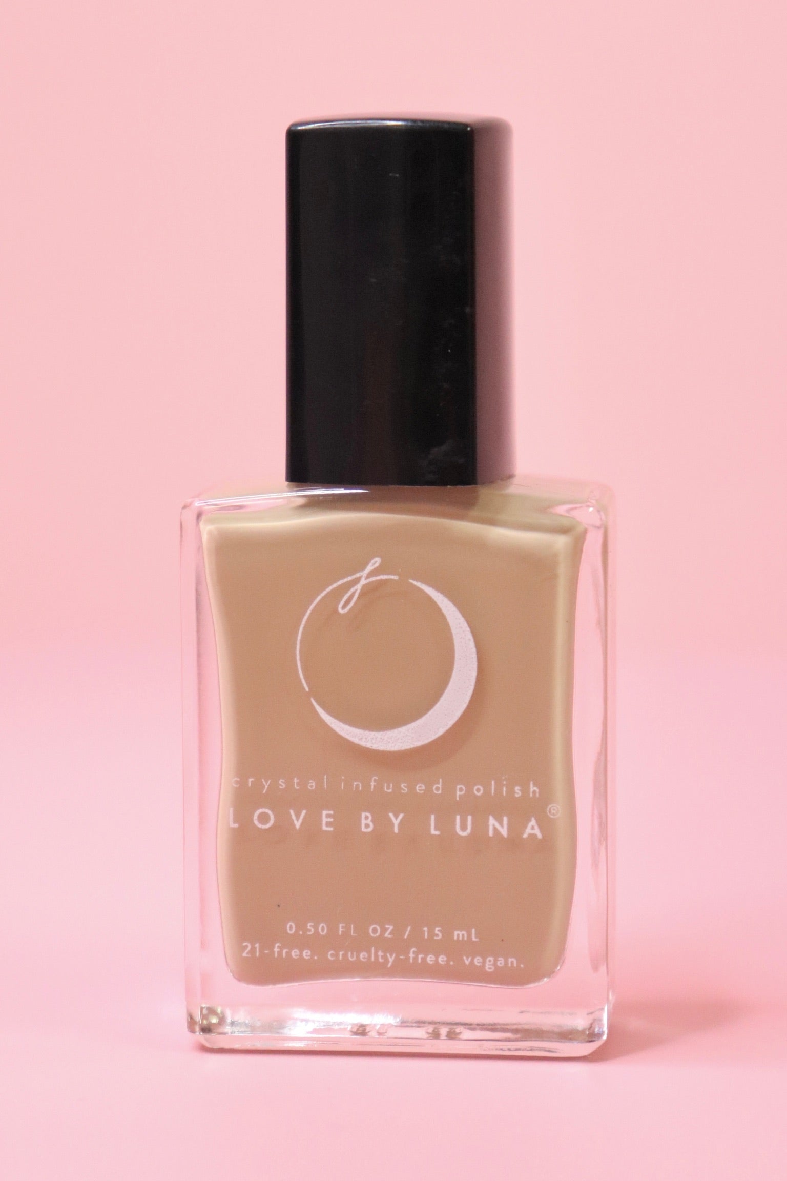 The Gaia Grounding Nail Polish with Micronized Hematite on a pink background.
