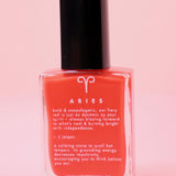 The Aries Zodiac Nail Polish with Micronized Red Jasper on a pink background.