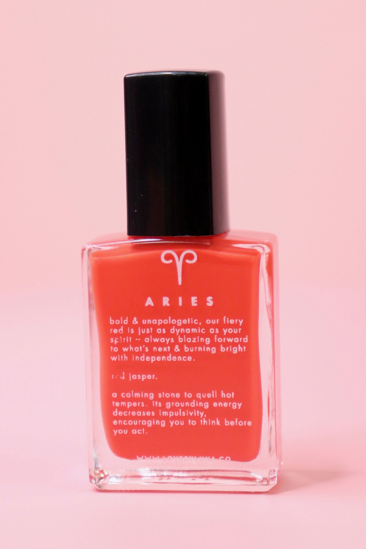 The Aries Zodiac Nail Polish with Micronized Red Jasper on a pink background.