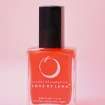 The Aries Zodiac Nail Polish with Micronized Red Jasper on a pink background.