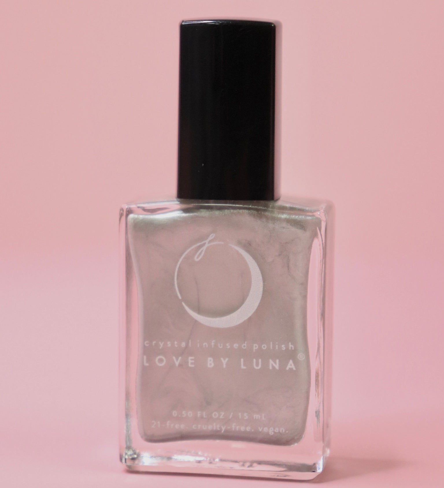 The Aquarius Zodiac Nail Polish with Micronized Amethyst on a pink background.