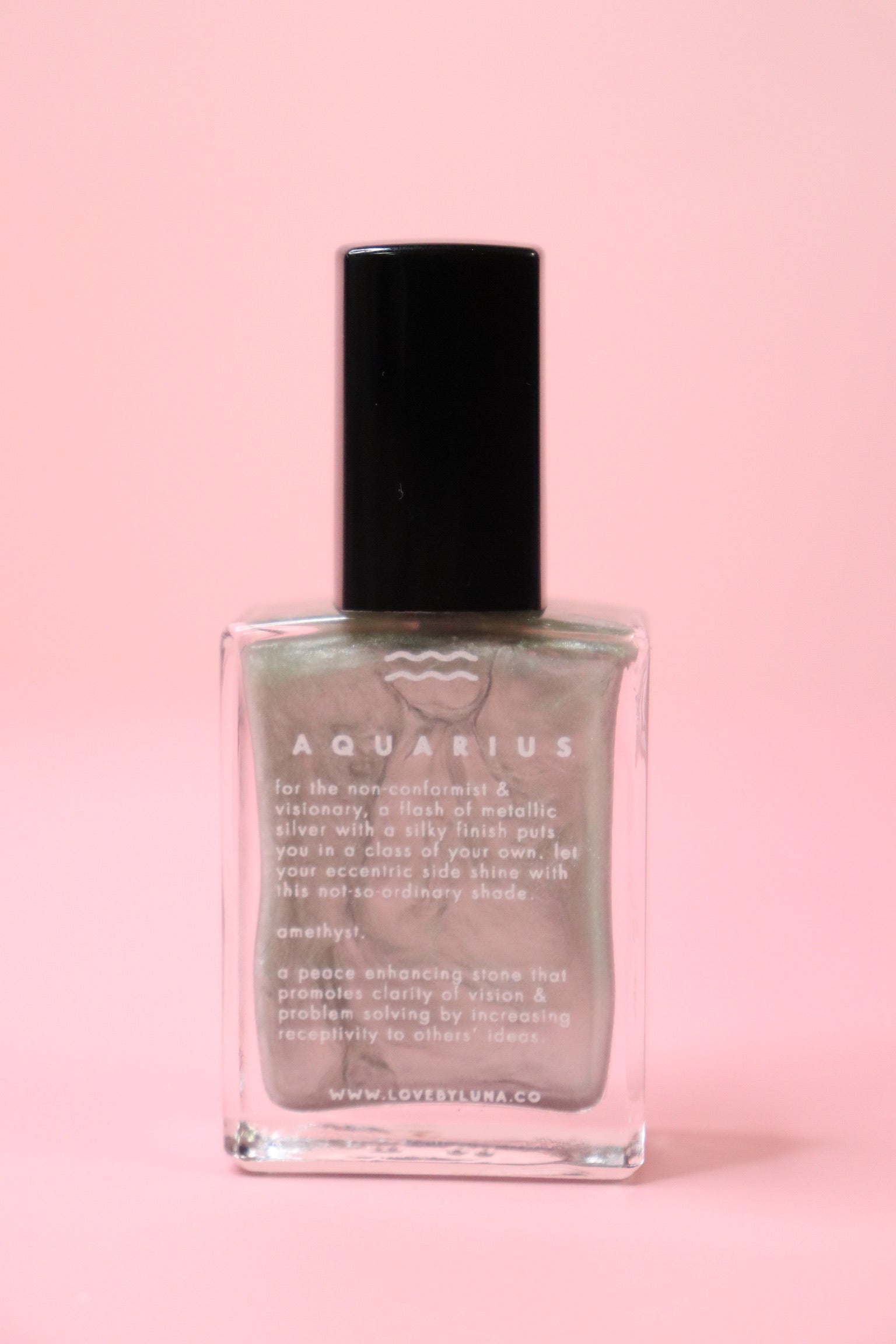 The Aquarius Zodiac Nail Polish with Micronized Amethyst on a pink background.