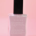 The Pisces Zodiac Nail Polish with Micronized Fluorite on a pink background.