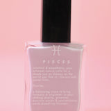 The Pisces Zodiac Nail Polish with Micronized Fluorite on a pink background.