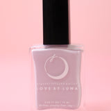 The Pisces Zodiac Nail Polish with Micronized Fluorite on a pink background.