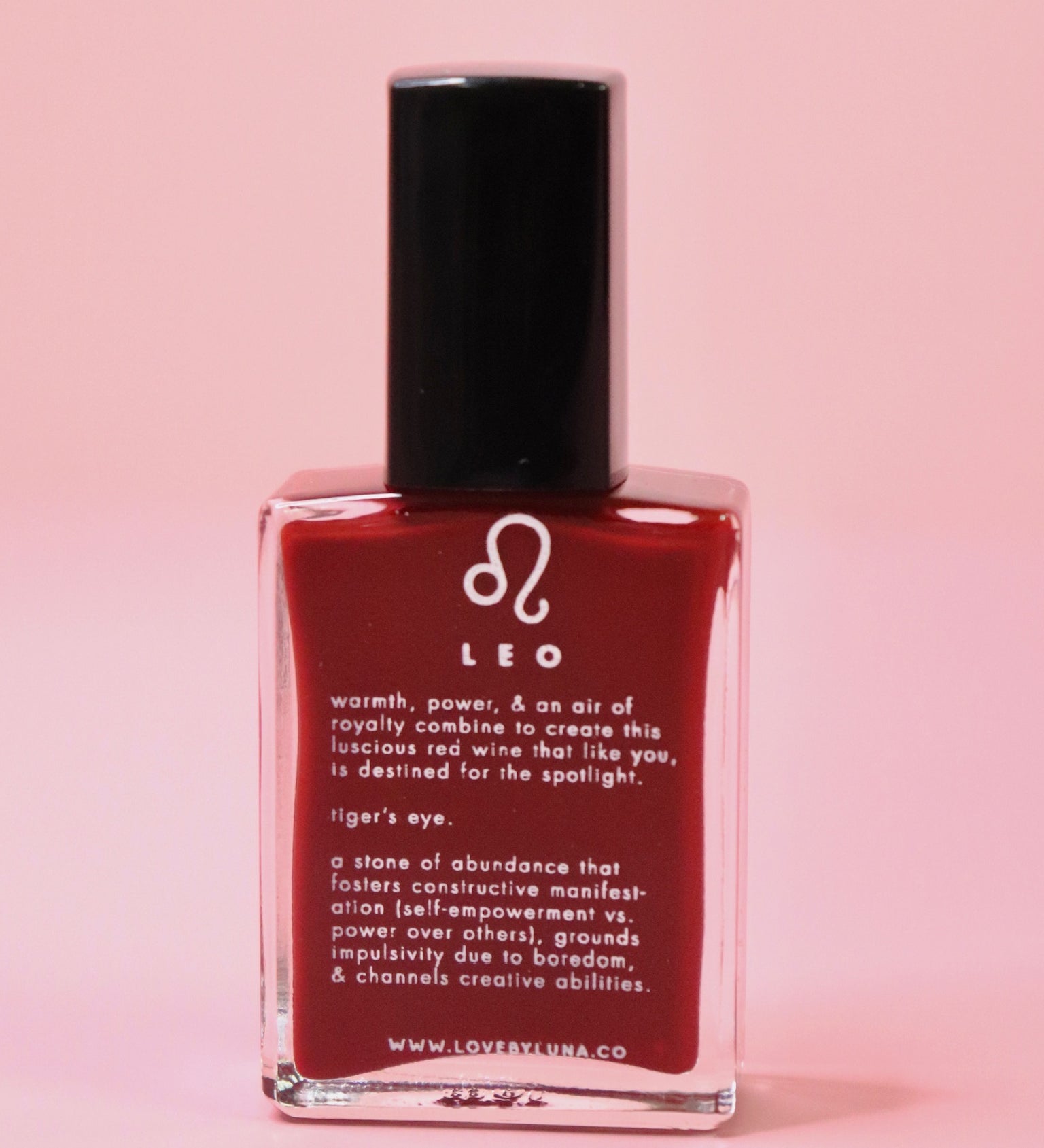 The Leo Zodiac Nail Polish with Micronized Tiger's Eye on a pink background.