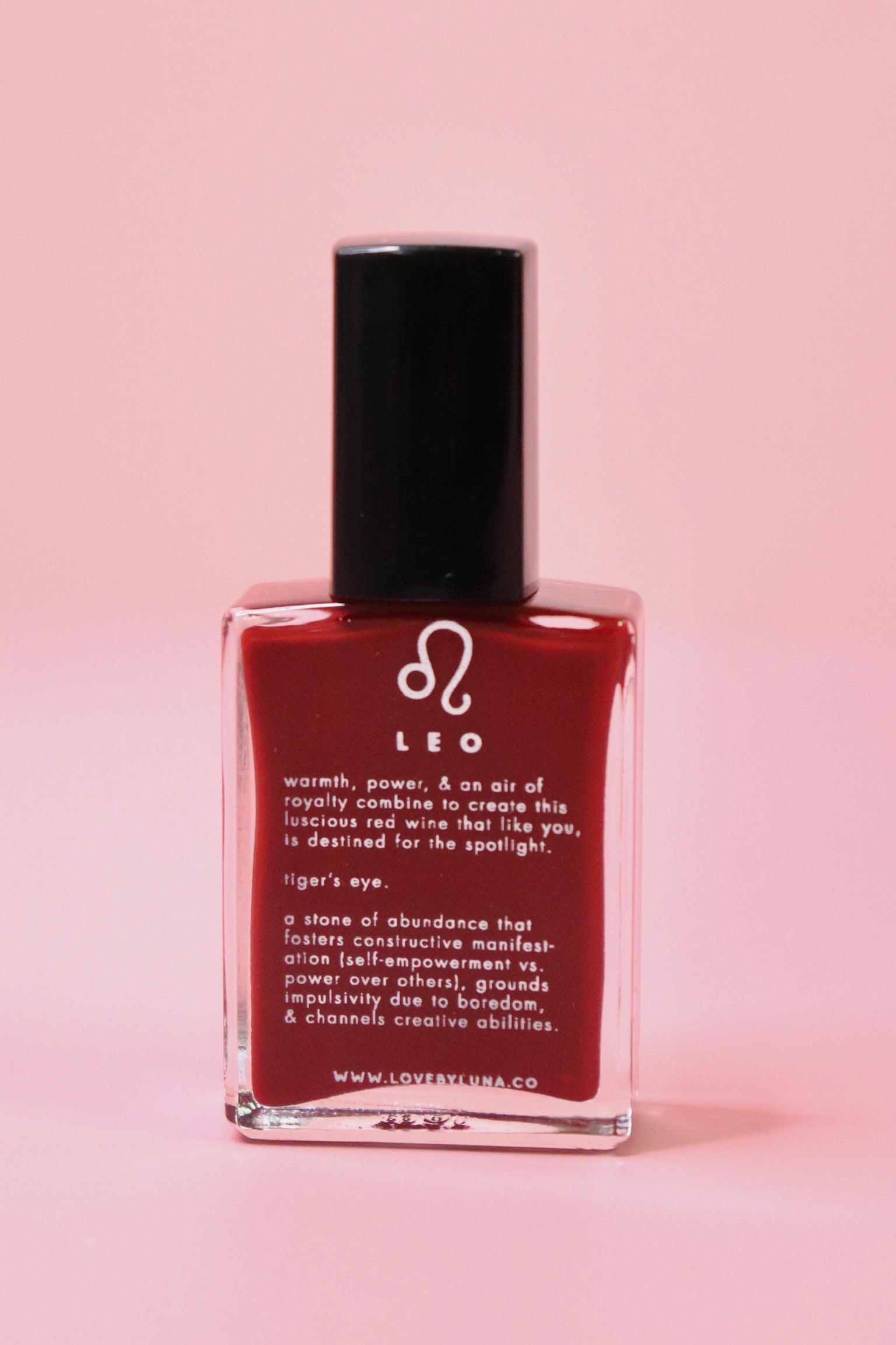 The Leo Zodiac Nail Polish with Micronized Tiger's Eye on a pink background.