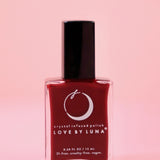 The Leo Zodiac Nail Polish with Micronized Tiger's Eye on a pink background.