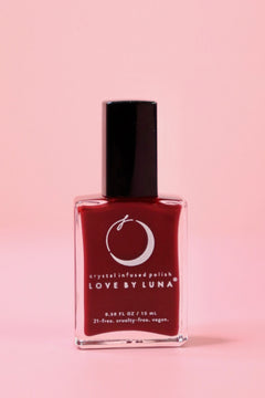 The Leo Zodiac Nail Polish with Micronized Tiger's Eye on a pink background.