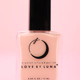The Hope & Healing Nail Polish with Micronized Morganite on a pink background.