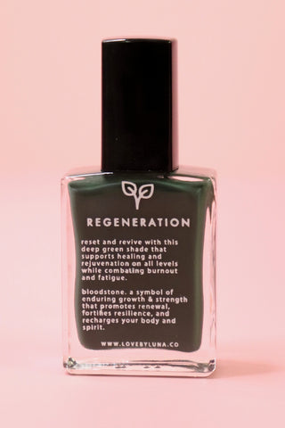 The Regeneration Nail Polish with Micronized Bloodstone on a pink background.