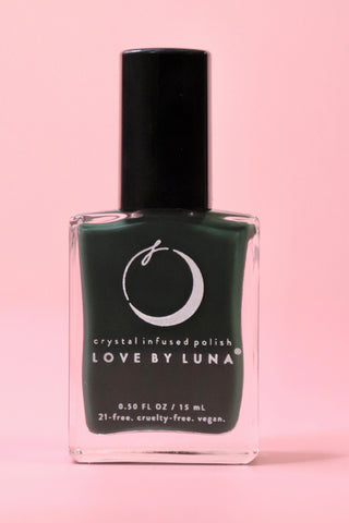 The Regeneration Nail Polish with Micronized Bloodstone on a pink background.